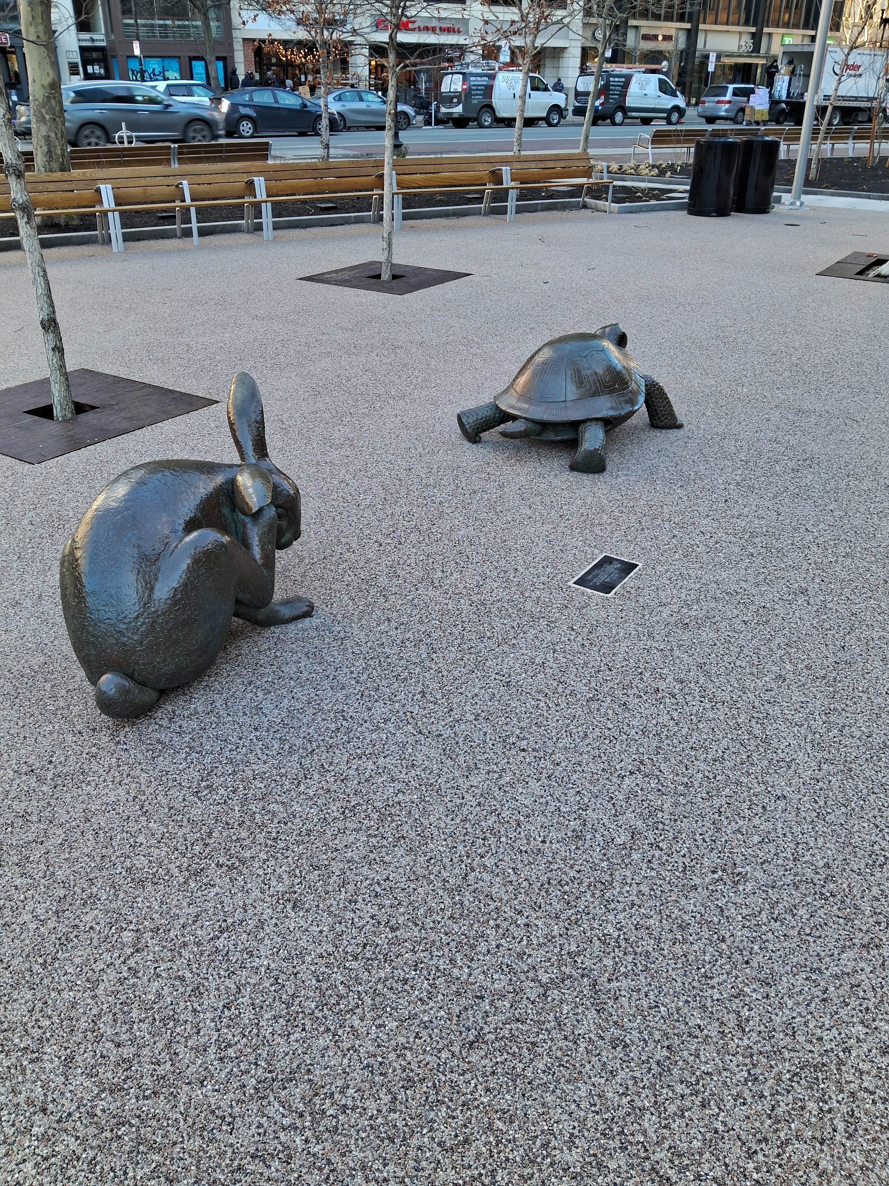 Statue of rabbit scracting himseelf & following turtle..jpg